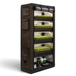 Multi-tier grow tent with lush green plants for indoor gardening.